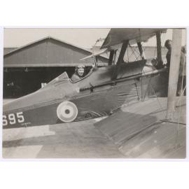 Pilot in biplane